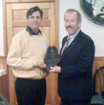 Dick Lambert receiving the first annual Code Enforcement Officer of the Year award from the MBOIA President